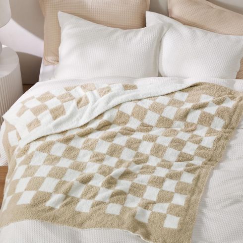 Checkered Throw Blanket Checkered throw blanket on bed