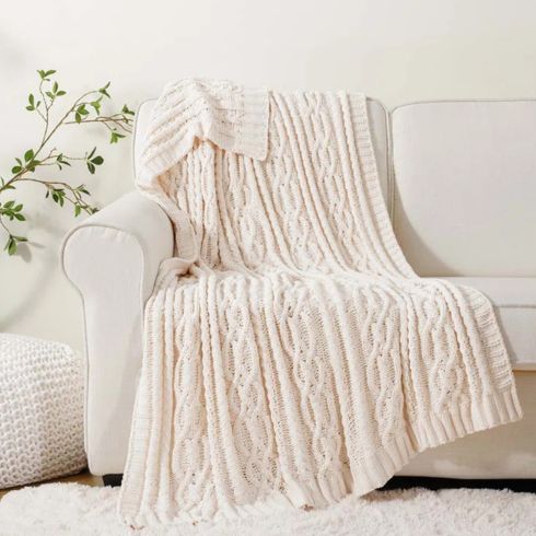 Knitted Throw Blanket White knitted throw blanket on white sofa