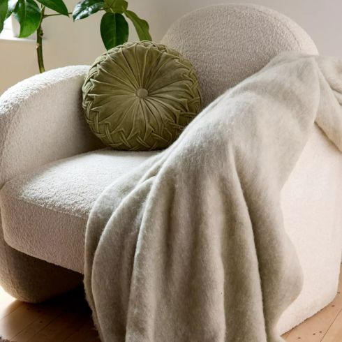 Faux Mohair Fur Throw Blanket Beige throw blanket on arm of white chair