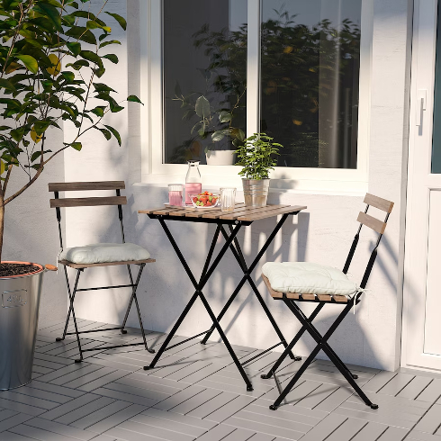A Bistro Set for Two The Taerno wooden bistro set from IKEA in a small patio space
