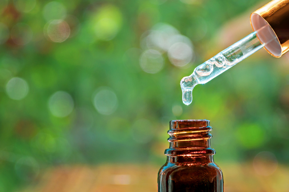 Tea Tree Oil Tea tree oil in a dropper