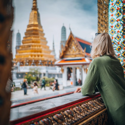 Thailand Person looking at Thai temples