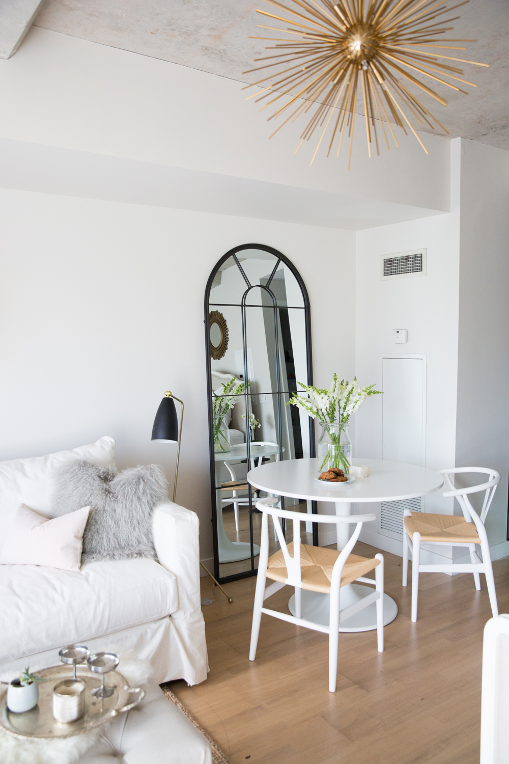 Surprise: A Sweet Studio Apartment Dining area in white studio apartment