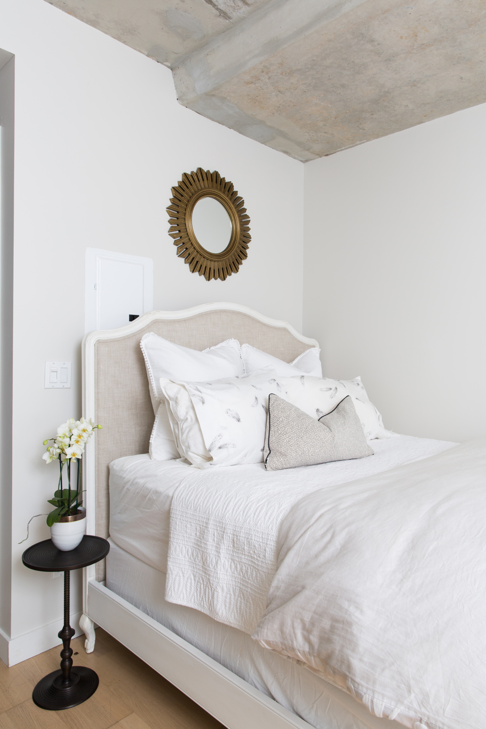 The Beautiful Bedroom Upholstered headboard and black side table