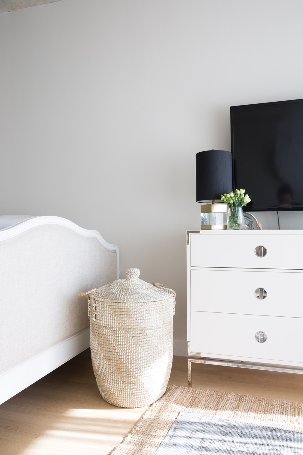 Where Grain Meets Gloss Glossy dresser with straw hamper