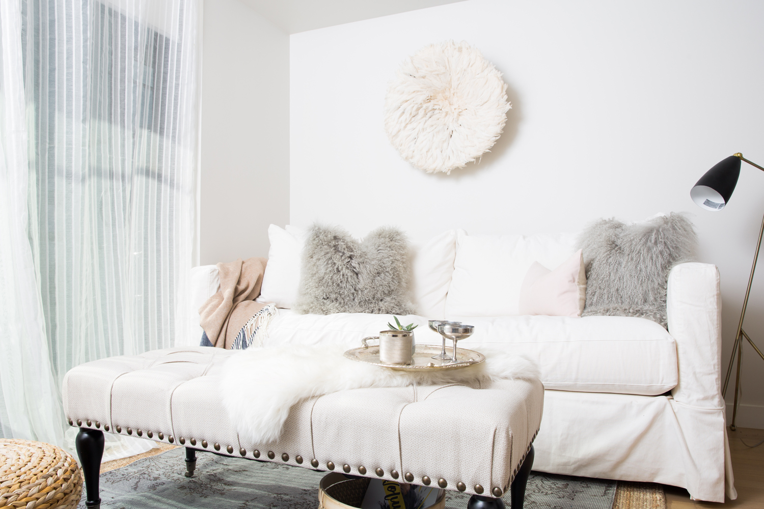 A Lush Living Room White living room with mohair pillows