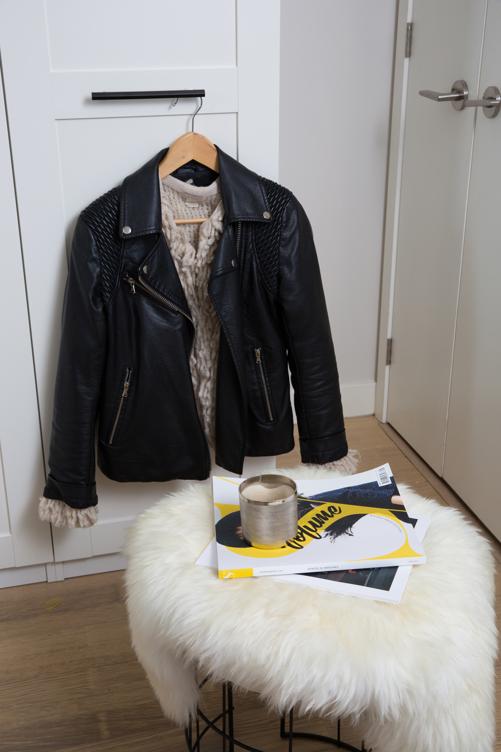 A Sweet Little Seat Small stool in entryway topped with sheepskin