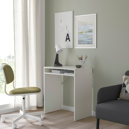 Small Space Saver The white Torald IKEA desk in a green room with green office chair