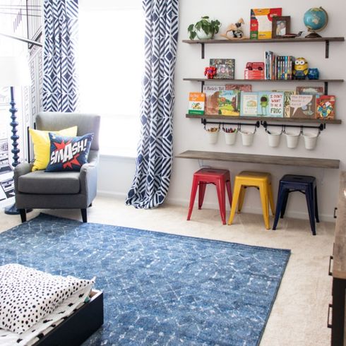 Wall Mounted Toy Storage Mounted toy storage in living room in blue palette