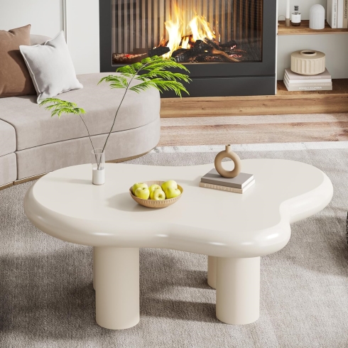 Cloud-Shaped Coffee Table A cream-coloured, cloud shaped coffee table.