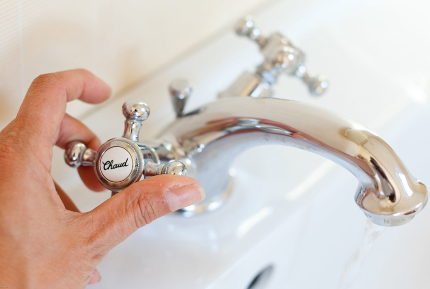 12. Turn Off the Tap Woman turning off tap