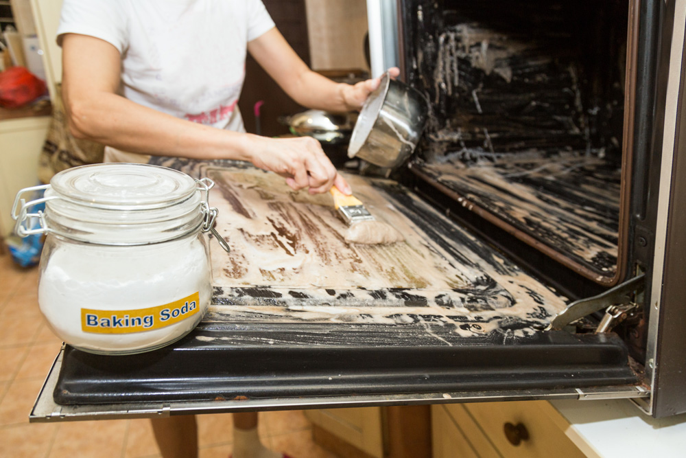 Use Baking Soda Cleaning an oven with baking soda