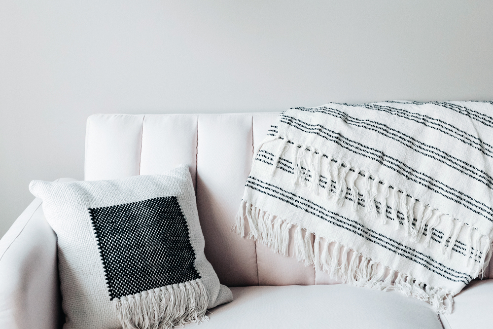 Do and Don’t: Throw Blankets a throw blanket on a white couch