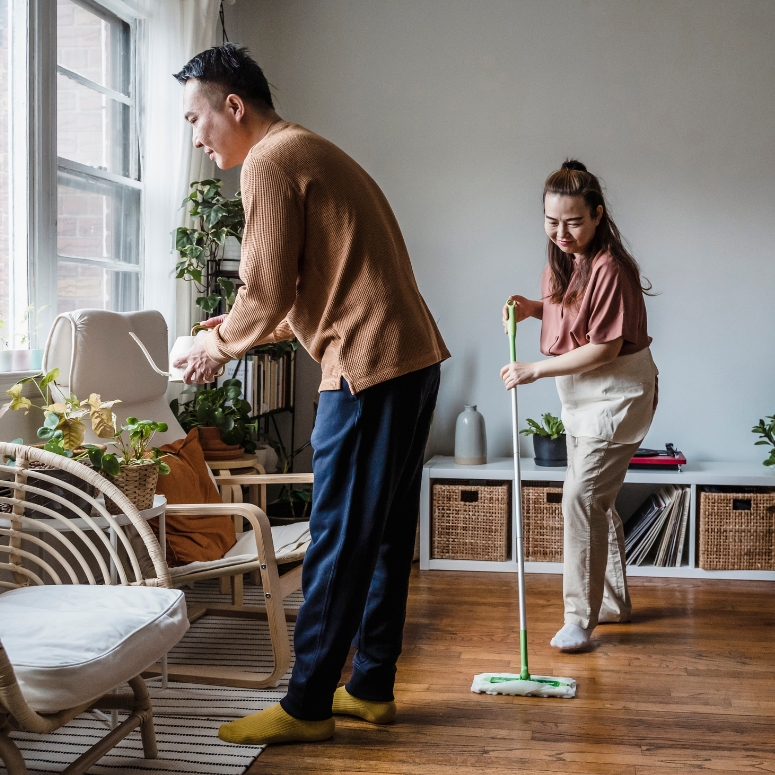 Edit What You Clean A man and woman cleaning their living room together