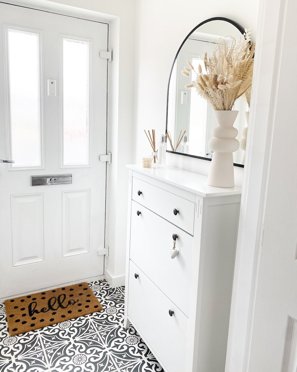 Tile the Floor A soft white neutral foyer with a patterned tile floor