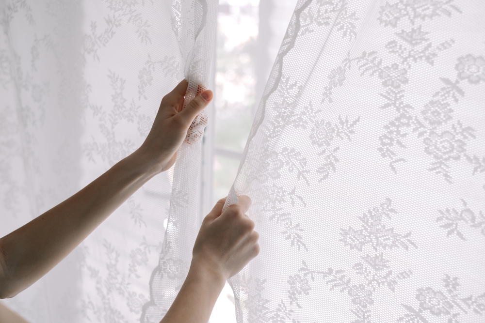 7. Open the Blinds Woman closing her curtains