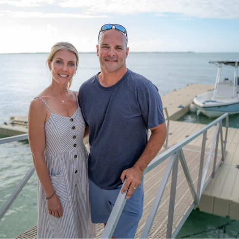 Where is the Caerula Mar Club? Bryan and Sarah Baeumler on a dock