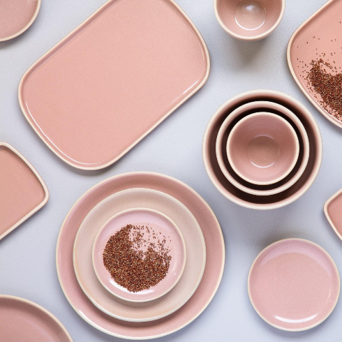 A Complete Pink Dinnerware Set A set of dishware in various shades of light pink