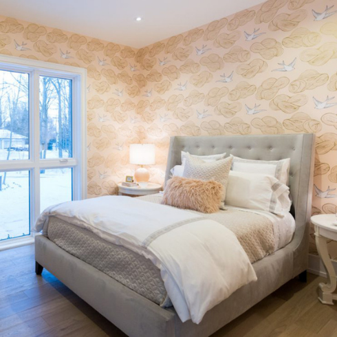 Marvellous Monochrome peach bedroom with bird wallpaper and grey bed