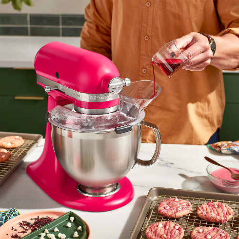A Hot Pink Stand Mixer A KitchenAid stand mixer in a hot pink shade