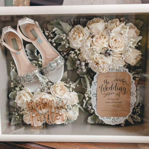 Create a Shadow Box A memory box of wedding shows and flowers.