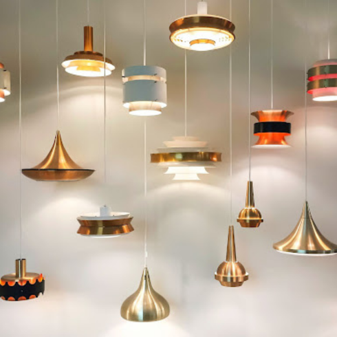 Statement Lighting Variety of modern lights hanging from a ceiling