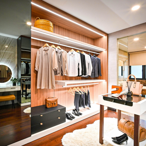 Custom Closets Large custom closets in a primary bedroom